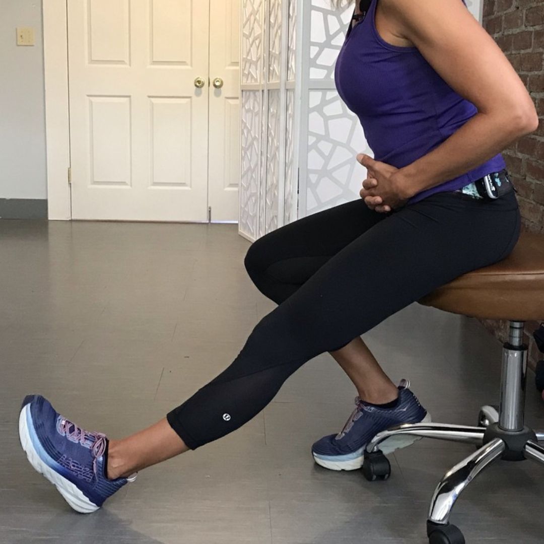 a women doing Seated Hamstring Stretch