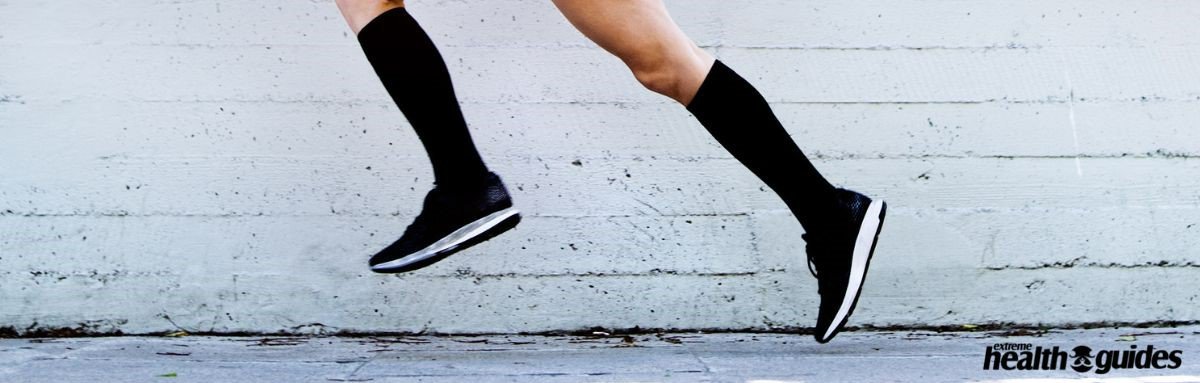 a human wearing Compression Socks and running on the ground