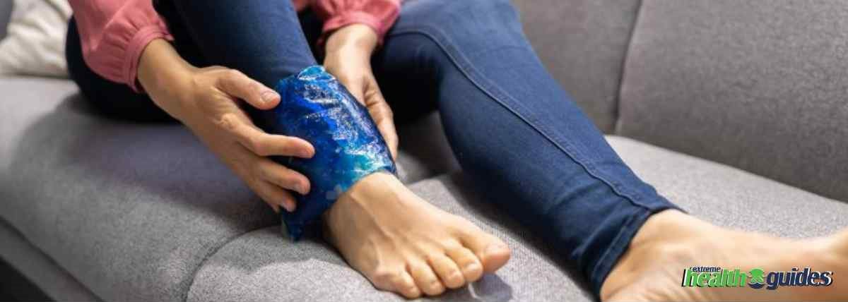 a human sitting on the sofa and using ice for neuropathy in feet