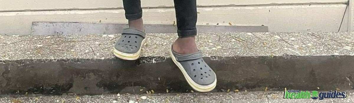 a human wearing Crocs